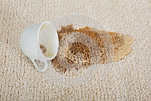 Coffee Spilling From Cup On Carpet