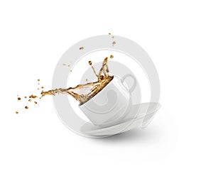 Coffee splash in white cup isolated