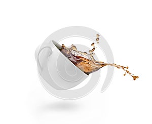 Coffee splash in white cup isolated
