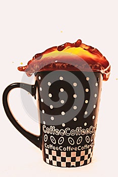 Coffee splashing out of cup