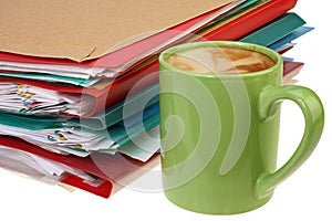 Coffee and stack of paper