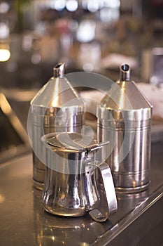 Coffee sugar milk dispensers in cafe bar