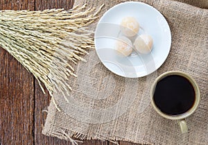 Coffee and sweetmeatwith rice drying on Sackcloth brown.