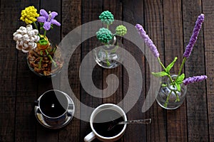 Coffee table with handmade flower by crochet, coffee cup, amazing artwork