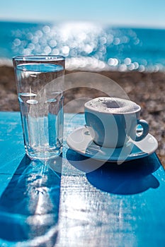 Coffee on the table on the sanny.