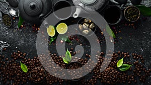 Coffee and tea banner. Aromatic coffee beans and tea leaves in cups with teapot. Traditional drinks