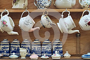 Coffee and tea shop decoration with shelves displaying blue and white porcelain tea sets.