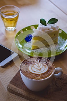 Coffee time and cake on wood table in cafe relax on the coffee b