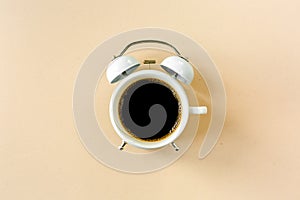 Coffee time, clock on yellow background. Flat lay, top view