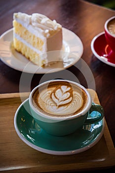 Coffee time in the wood table cafe , drink coffee and tasty cake