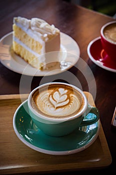 Coffee time in the wood table cafe , drink coffee and tasty cake