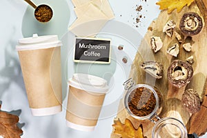 Coffee to go cups with pieces of dry mushrooms with chaga powder