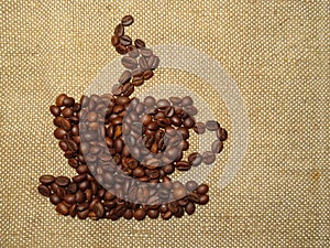 Coffee ÃÂup made of roasted coffee beans on burlap