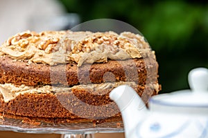 A Coffee and Walnut Cake on a Cake Stand for Afternoon Tea
