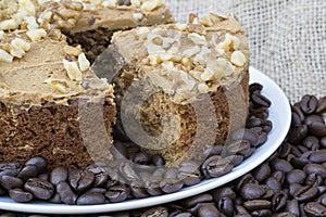 Coffee and walnut layer cake with cup of coffee