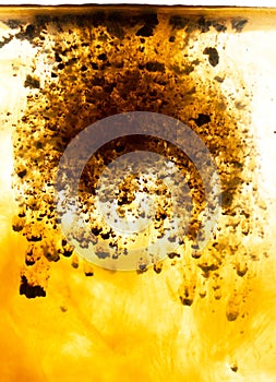 Coffee dissolves in wateras background