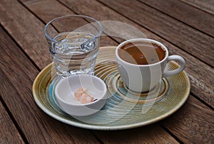 coffee and water on wooden coffee table photo