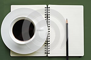 Coffee in white cup with Journal book and pencil