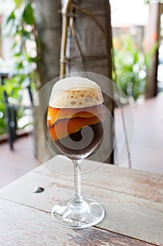 Coffee in wine glass with orange shell