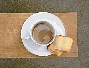 Coffee witch cake on wooden board