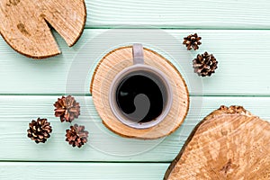 Coffee, wooden stumps and pine cones for blog background top view