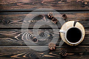 Coffee, wooden stumps and pine cones for blog background top view space for text