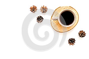 Coffee, wooden stumps and pine cones for blog background top view space for text