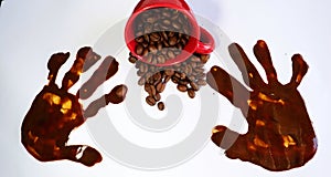 Coffeebeans and a red espresso cup on a table