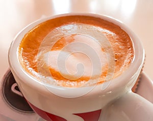 Coffeecup with foam.