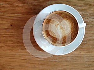 Coffeecup of with heart shape art on foam