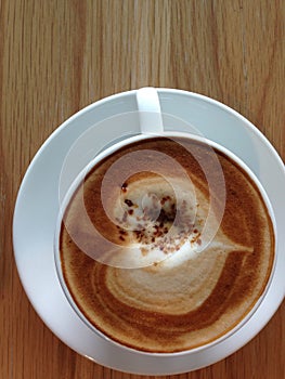 Coffeecup of with heart shape art on foam