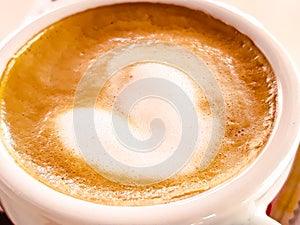 Coffeecup with foam.