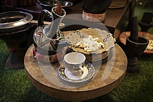 coffeepot and a coffee mug. Drinking coffee in Arabic style. Coffee house