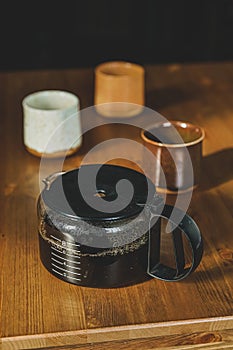 Coffepot with three cups