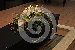 Coffin with funeral flowers
