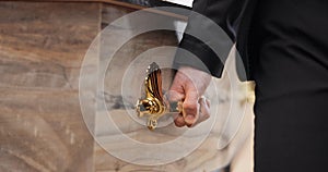 Coffin, hands and pallbearer walking at cemetery ceremony outdoor at tomb. Death, grief and person with casket at