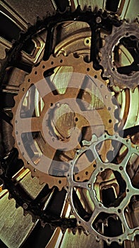 Cog wheels, rust colored on gold