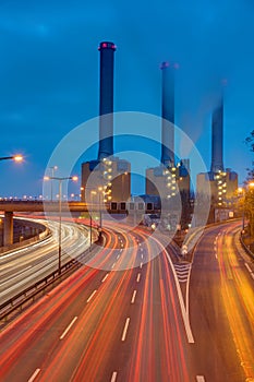 Cogeneration plant and highway at night photo