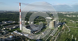 Cogeneration power plant construction area in Vilnius, Lithuania. Close to Gariunai Market.  Very big Chimney. Forest in