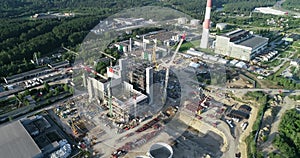 Cogeneration Power Plant Construction Area in Vilnius, Lithuania. Close to Gariunai Market.  Very big Chimney. Forest in