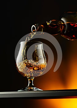 Cognac or brandy being poured into a glass