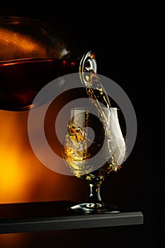 Cognac or brandy being poured into a glass