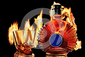 Cognac, brandy, whiskey or the like on a fire background