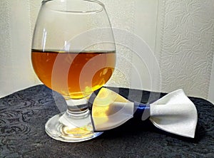 Cognac and butterfly tie