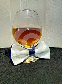 Cognac and butterfly tie