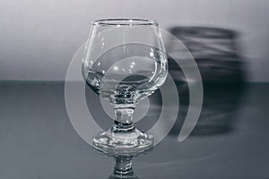 Cognac empty glass of dark background