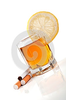 Cognac with lemon and cigarettes