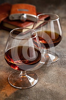 Cognac or whiskey in glasses on  dark background