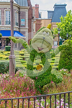 Cogsworth character topairy displayed at Epcot