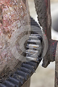 Cogwheels on a rust cementmixer